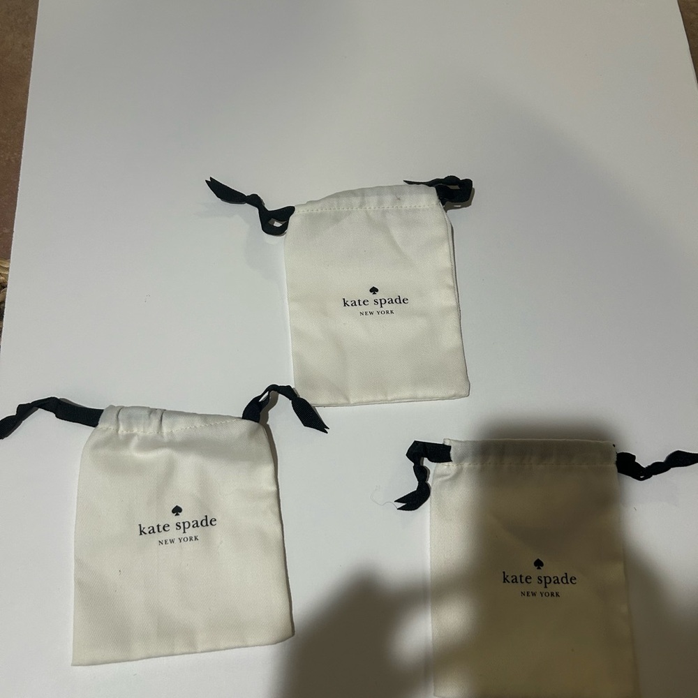Kate Spade Cream Pouches with Black Ties